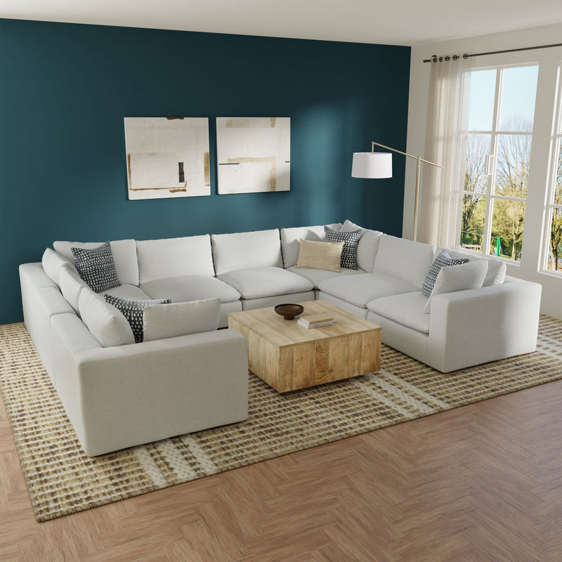 Simpli-Home Jasmine handcrafted sectional sofa in a stationary design, featuring plush cushions and neutral upholstery.