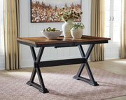 Wildenauer dining room extension table by Signature Design Ashley, showcasing a sleek counter table with extendable surface and modern style.