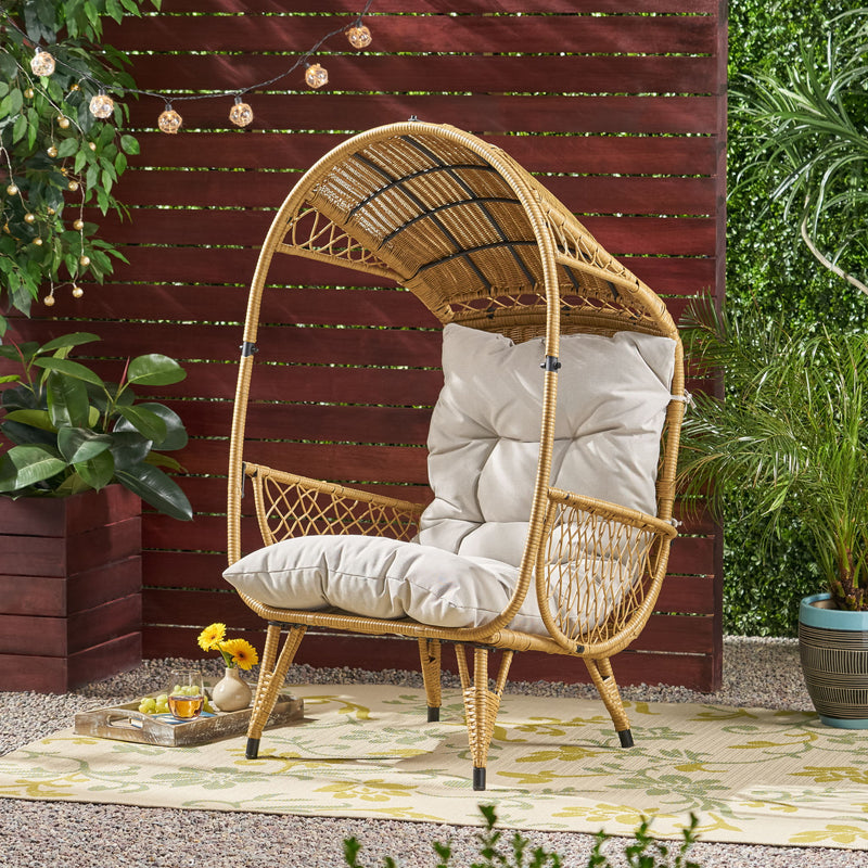 Noble House outdoor wicker standing basket chair with cushion, accent furniture for patio or garden sitting area.