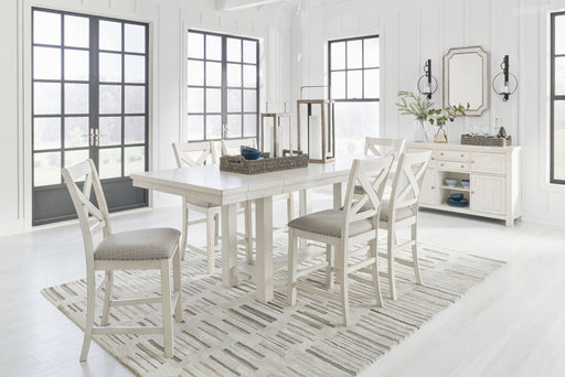 Signature Design by Ashley Robbinsdale rectangular counter height dining extension table with six matching chairs in a 7-piece dining set.