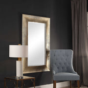 Large Valenton wall mirror by Uttermost with champagne-colored frame, elegant and reflective surface for stylish interior decor.