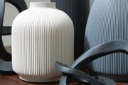 Signature Design by Ashley Leithick accessory set with five black, tan, and gray table accessories arranged together.