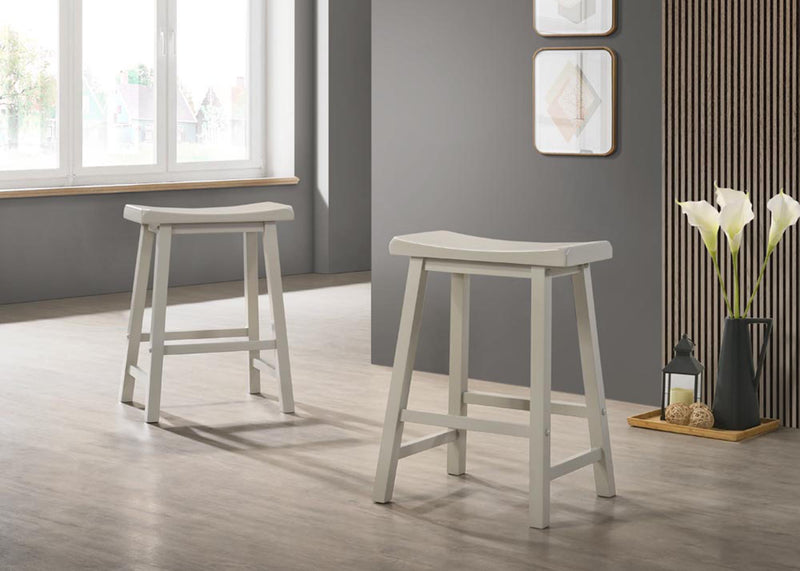 Set of two Lilola Home Alonzo 17.5-inch backless ergonomic counter height stools with wooden legs and neutral fabric seats.