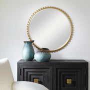 Round iron wall mirror by Uttermost featuring a sleek, minimalist design suitable for modern interiors.