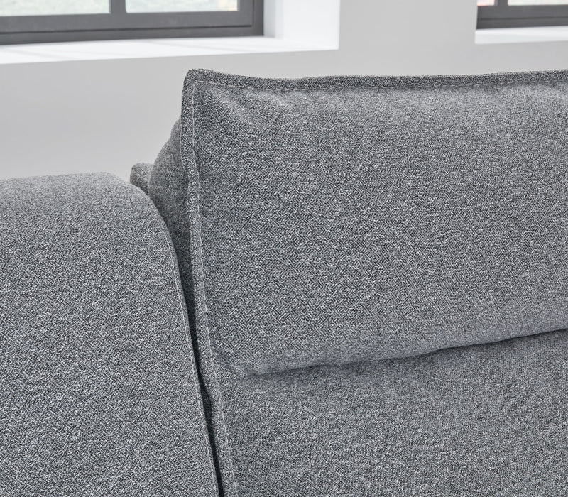 Reclining sectional sofa in salt and pepper fabric by Signature Design by Ashley, featuring multiple reclining seats and plush cushions.