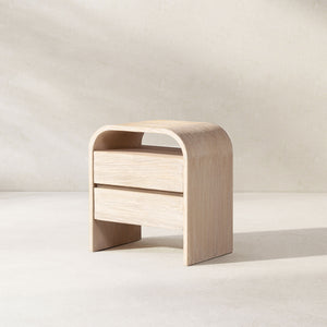 White washed Dune side table by Jennifer Taylor Home with a sleek, modern design and smooth finish.
