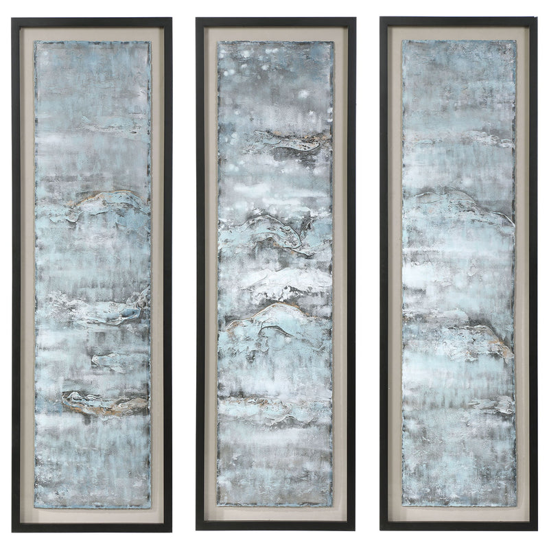 Set of three blue painted metal wall decor art pieces by Uttermost, featuring ocean-inspired abstract wave designs.