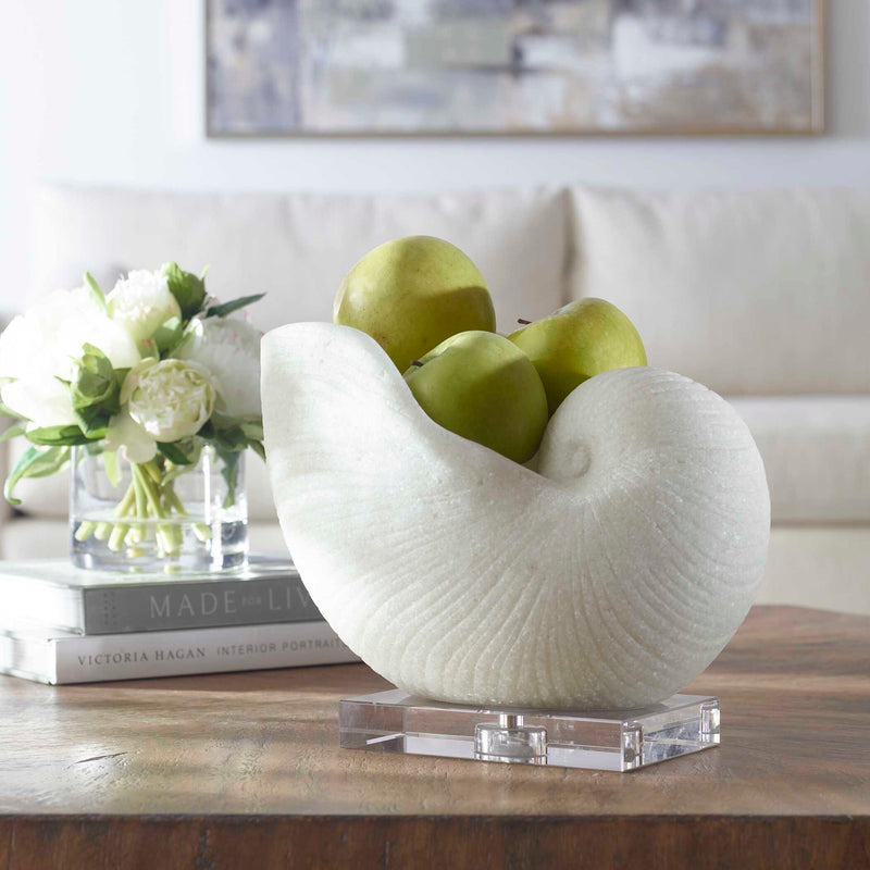 White Nautilus shell sculpture by Uttermost, detailed decorative figurine for home decor, made of textured sculpture material.