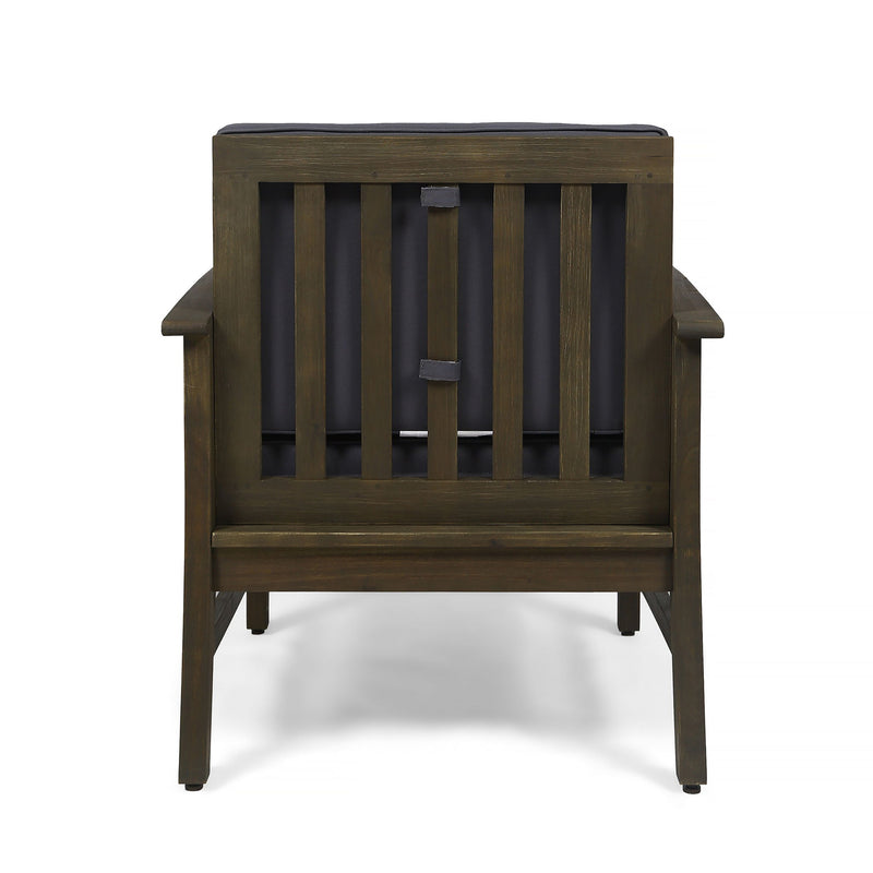 Dark gray outdoor Noble House club arm chair with slat panel design and water-resistant cushion, ideal for comfortable outdoor seating.