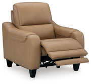 Ashley Mosswell power recliner with adjustable headrest in toffee leather, showing plush cushioning and reclining mechanism.