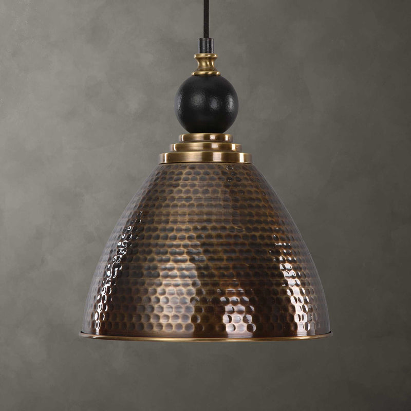 Uttermost Adastra 1-light pendant in antique brass with a sleek, modern design and metal construction for stylish pendant lighting.