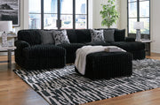 Signature Design by Ashley Midnight-Madness 4-piece sectional set for living room with plush cushions and modern design.