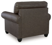 Benchcraft Roxmere living room set featuring a stationary chair and ottoman with plush upholstery and modern design.