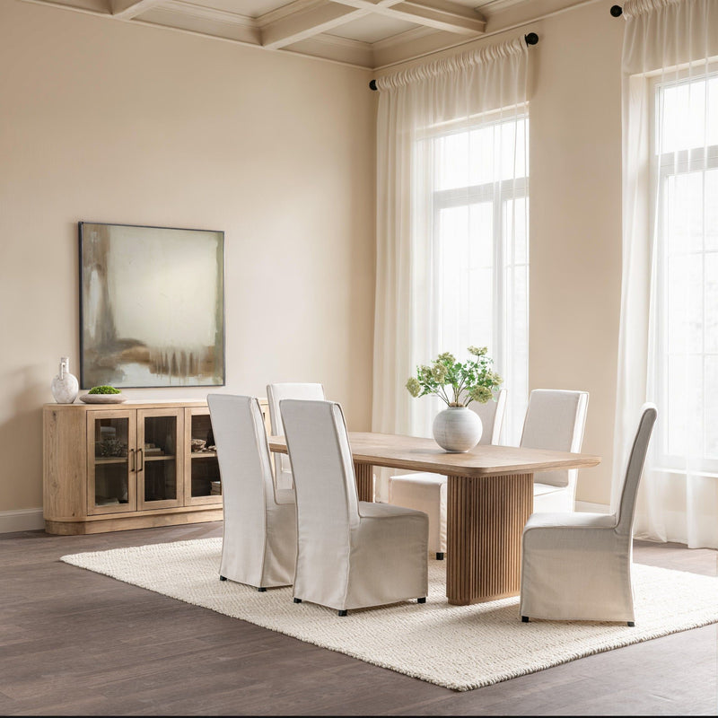 Vander Oak Wood 84-inch dining table by Classic Home, showcasing a sturdy wooden surface with a modern design and smooth finish.