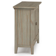 Redmond handcrafted low storage accent cabinet by Simpli-Home with a rustic wood finish and compact design.