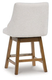 Cabalynn - Upholstered Swivel Barstool (Set of 2) - Oatmeal / Light Brown - R&R Furniture Gallery (Fountain Valley, CA)