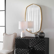 Uttermost Duronia iron wall mirror with a sleek, modern frame hanging on a wall, showcasing contemporary home decor style.