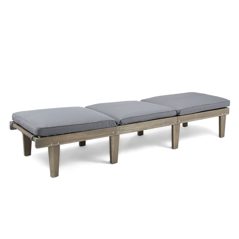 Noble House Ariana wood chaise lounge with cushion, featuring a sleek design and comfortable seating for relaxing outdoors.