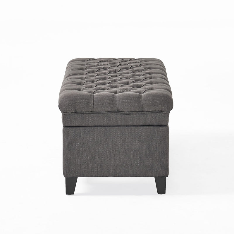 Noble House Juliana storage ottoman with beige fabric and birch wood legs, versatile seating and hidden storage.