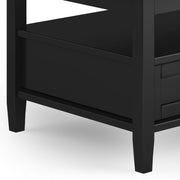Handcrafted Warm Shaker coffee table by Simpli-Home featuring a wooden surface and sturdy legs in a warm finish