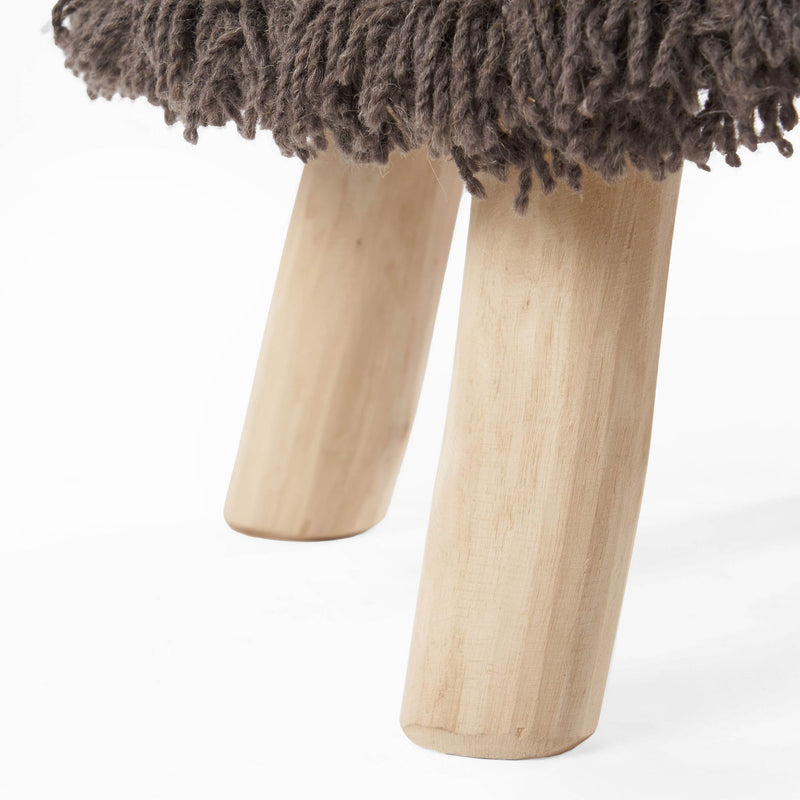 Dark brown handcrafted wool and cotton foot stool with eucalyptus wood frame, styled as a Noble House ottoman.
