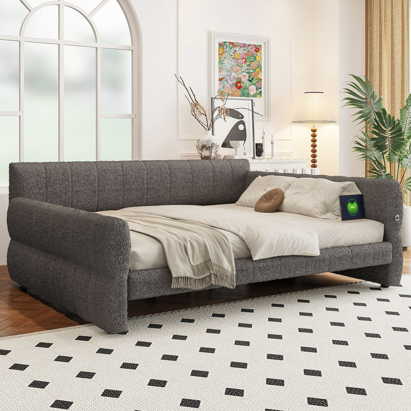 Dreamland upholstered storage platform bed with integrated USB charging ports, featuring a padded headboard and sleek design.