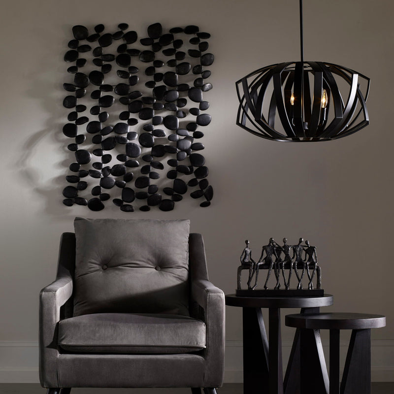 Uttermost black forged iron wall art featuring stacked stone design for modern wall decor.