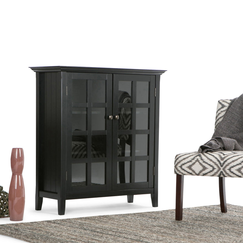 Handcrafted Acadian medium storage cabinet by Simpli-Home with wood finish and modern design, featuring multiple storage compartments.