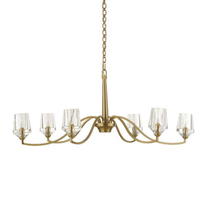 Uttermost Barcelona 6-light brass chandelier with gold finish, featuring elegant curved arms and clear glass shades.
