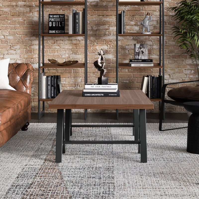 Handcrafted solid wood sawhorse coffee table by Simpli-Home with a rustic design and sturdy construction.