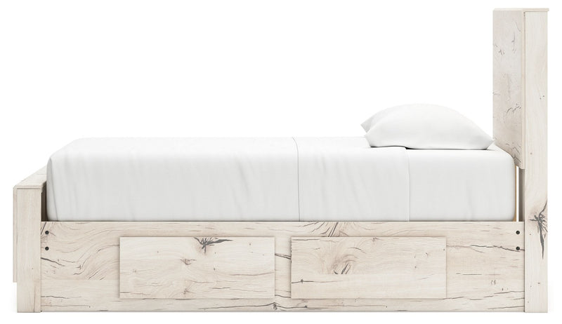 Signature Design by Ashley Lawroy panel bed with built-in storage drawers in a modern bedroom setting.