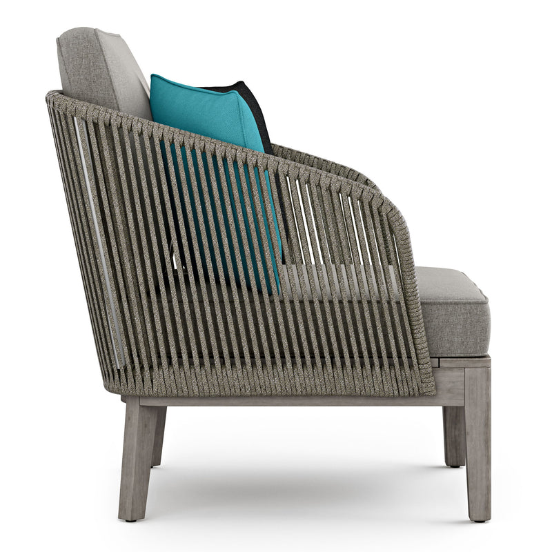 Simpli-Home Carmel outdoor conversation arm chair in Sand Drift color, featuring comfortable cushioned seating and sturdy frame.