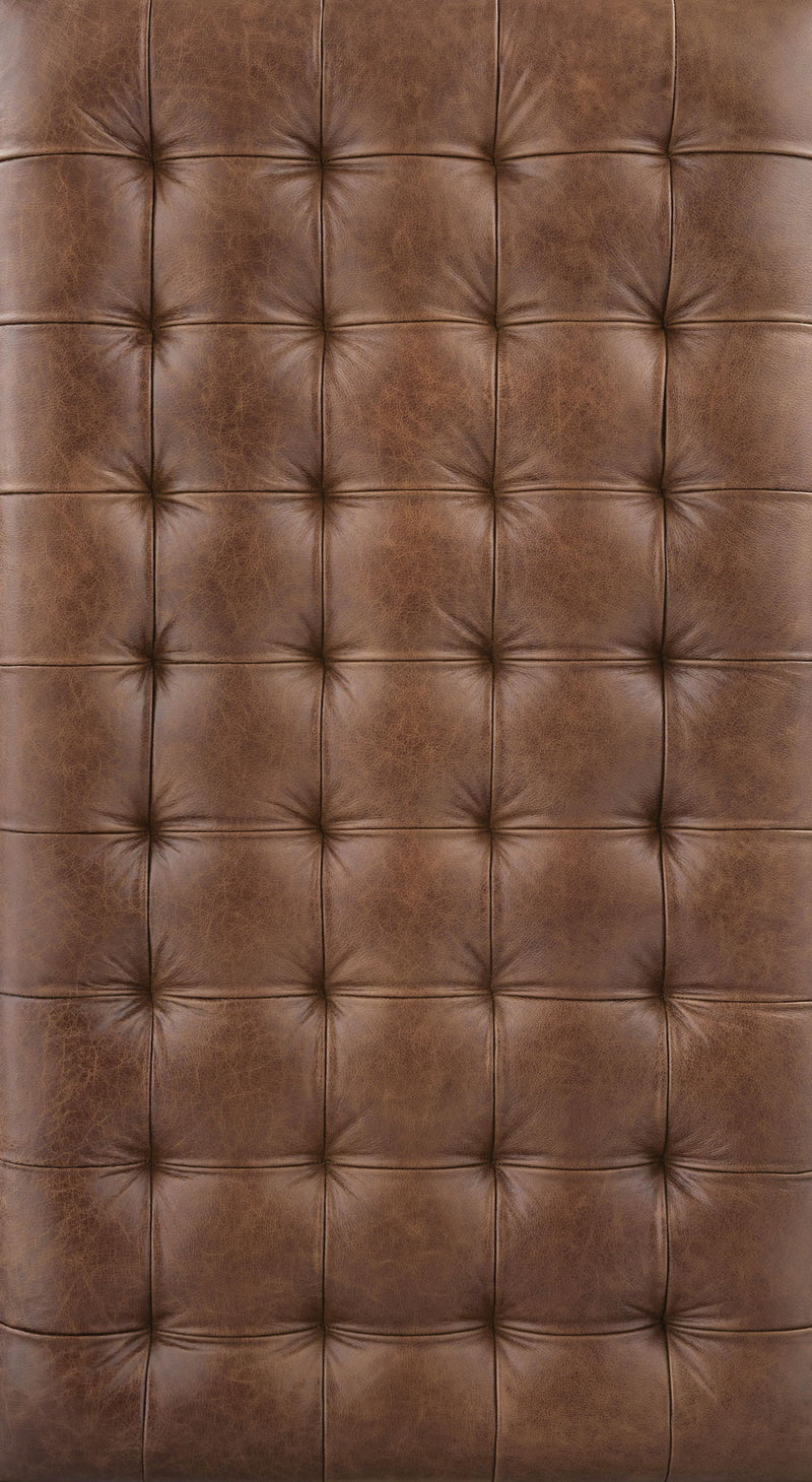 Brown and black cocktail ottoman from Signature Design by Ashley, featuring a stylish, versatile coffee table ottoman design.