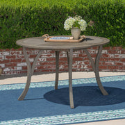 Hermosa outdoor acacia wood circular dining table by Noble House, featuring a sturdy, elegant design for outdoor dining spaces.