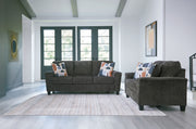 Benchcraft® Erinslane living room set with stationary chair and ottoman, featuring plush upholstery and modern design.