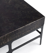 Rust Noir Adela coffee table by Classic Home featuring a sleek, modern design with a dark finish and sturdy metal legs.