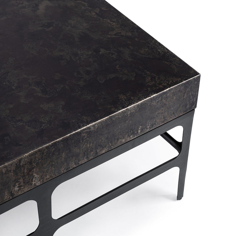 Rust Noir Adela coffee table by Classic Home featuring a sleek, modern design with a dark finish and sturdy metal legs.