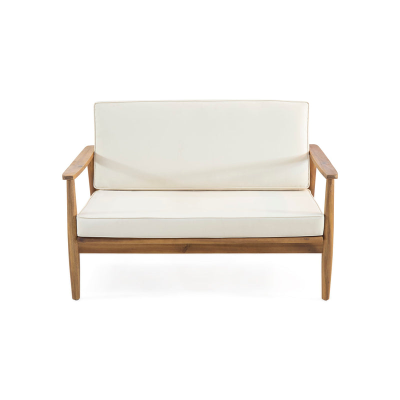 Outdoor acacia wood loveseat set with matching coffee table from Noble House, featuring two-seater outdoor furniture on a patio.