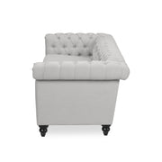 Noble House Chesterfield style 3-seater sofa with deep button tufting and classic stationary design, upholstered in plush fabric.