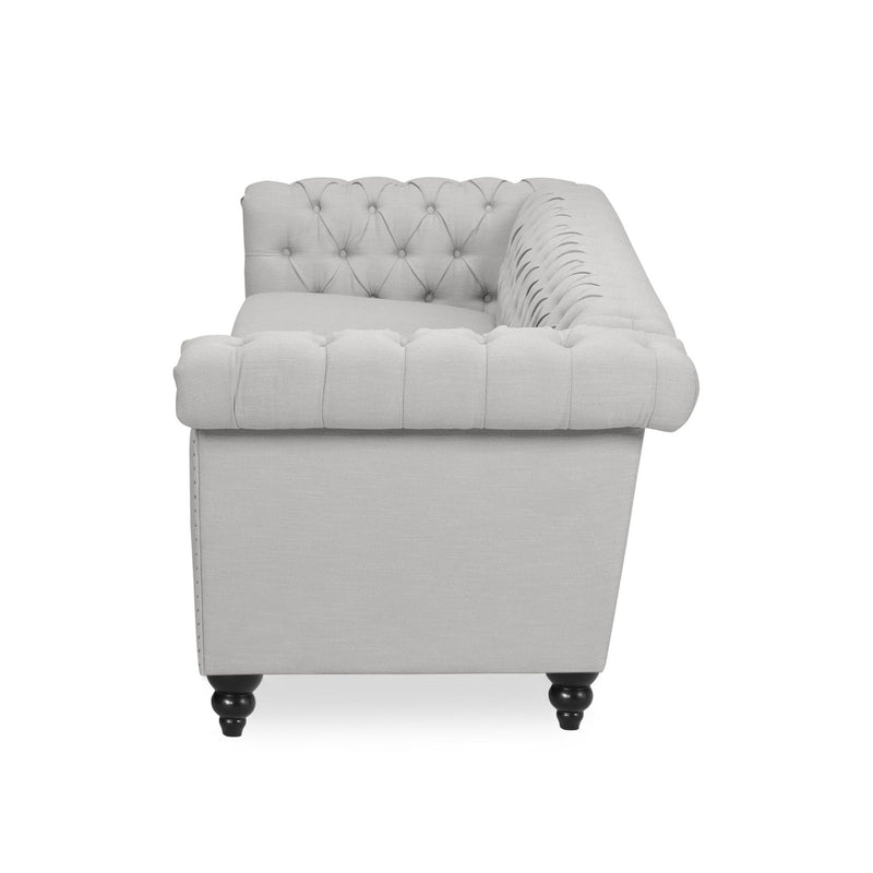 Noble House Chesterfield style 3-seater sofa with deep button tufting and classic stationary design, upholstered in plush fabric.