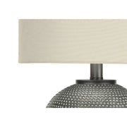 Modern gray and cream table lamp by 8th Street featuring a sleek design with a cylindrical shade and minimalist base.