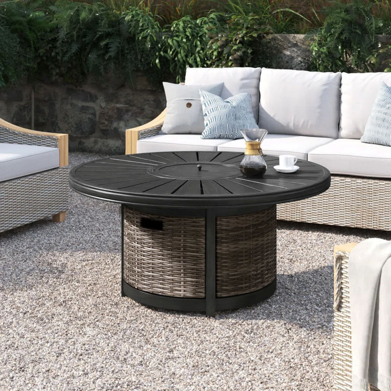 L-shaped brown Cassara Resort propane outdoor fire pit table by LSI Patio Furniture with a fire bowl and surrounding surface.