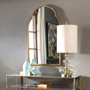 Uttermost Kenitra arched mirror with elegant curved frame, wall-mounted decor piece, showcasing a stylish and sophisticated design.