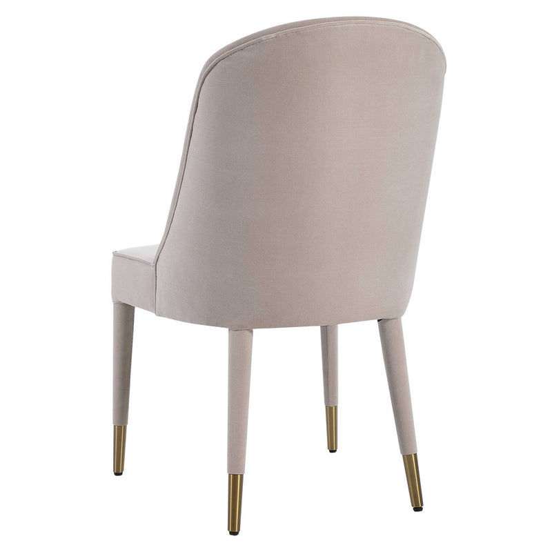 Set of two Uttermost Brie armless chairs with modern design, featuring neutral upholstery and sleek wooden legs.