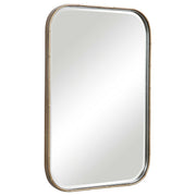 Uttermost Malay gold vanity mirror with a sleek, round frame, reflecting a modern and elegant bathroom decor.