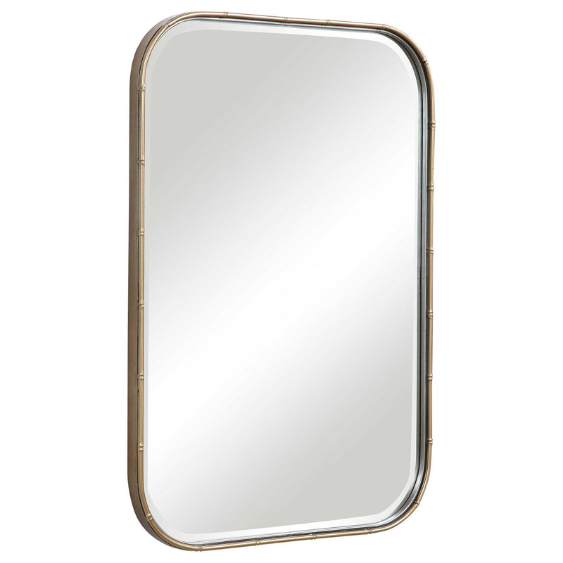 Uttermost Malay gold vanity mirror with a sleek, round frame, reflecting a modern and elegant bathroom decor.