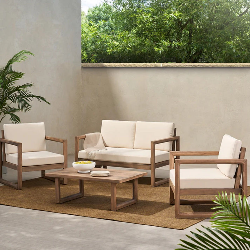 Noble House 4-piece acacia wood outdoor furniture set with beige cushions, includes porch chairs and coffee table for backyard or balcony.