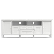 Handcrafted Warm Shaker TV media stand by Simpli-Home with open shelves and storage compartments for media devices and decor.