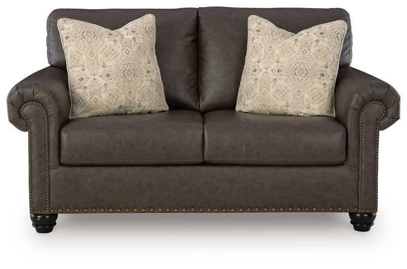 Benchcraft Roxmere living room set with stationary chair and matching ottoman, featuring plush upholstery and modern design.