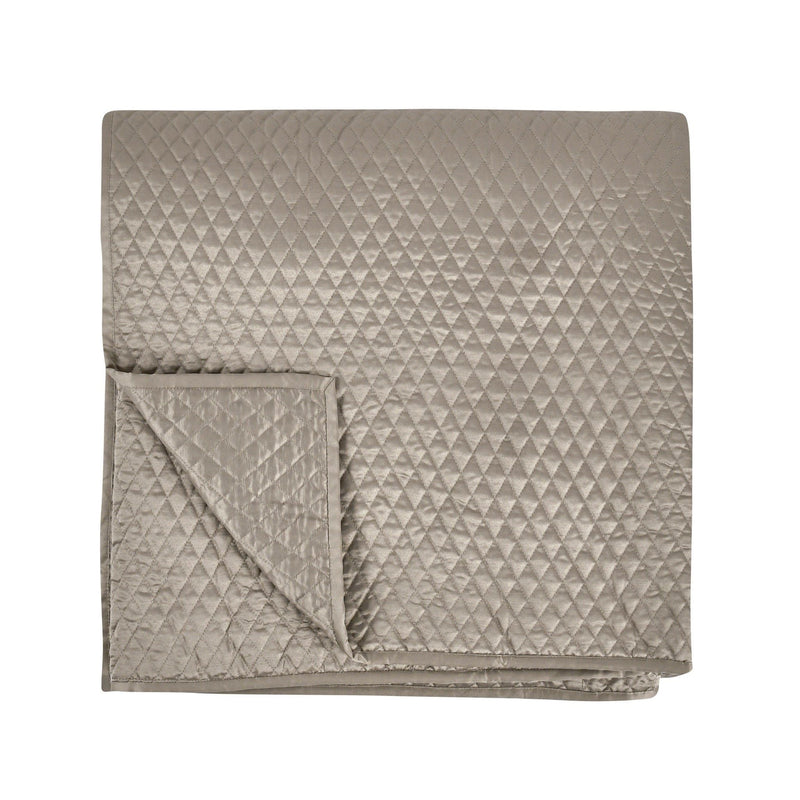 Classic Home diamond quilt with matching shams, featuring a textured pattern and soft, cozy fabric for a stylish bedroom look.